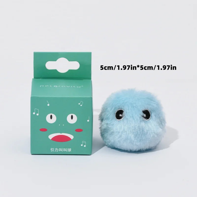 Small blue plush toy next to its packaging on a white background